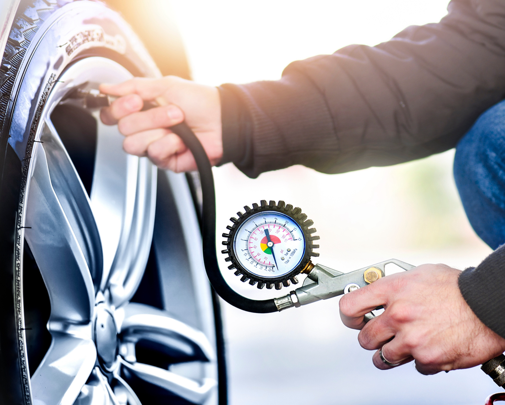 A person pumping up a tyre.